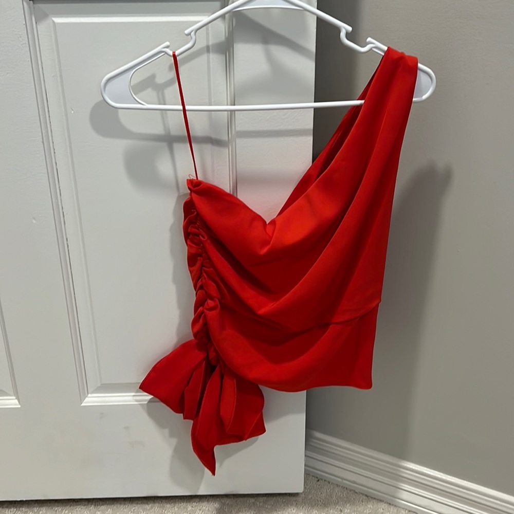 Red one shoulder top with bow. Boutique top
